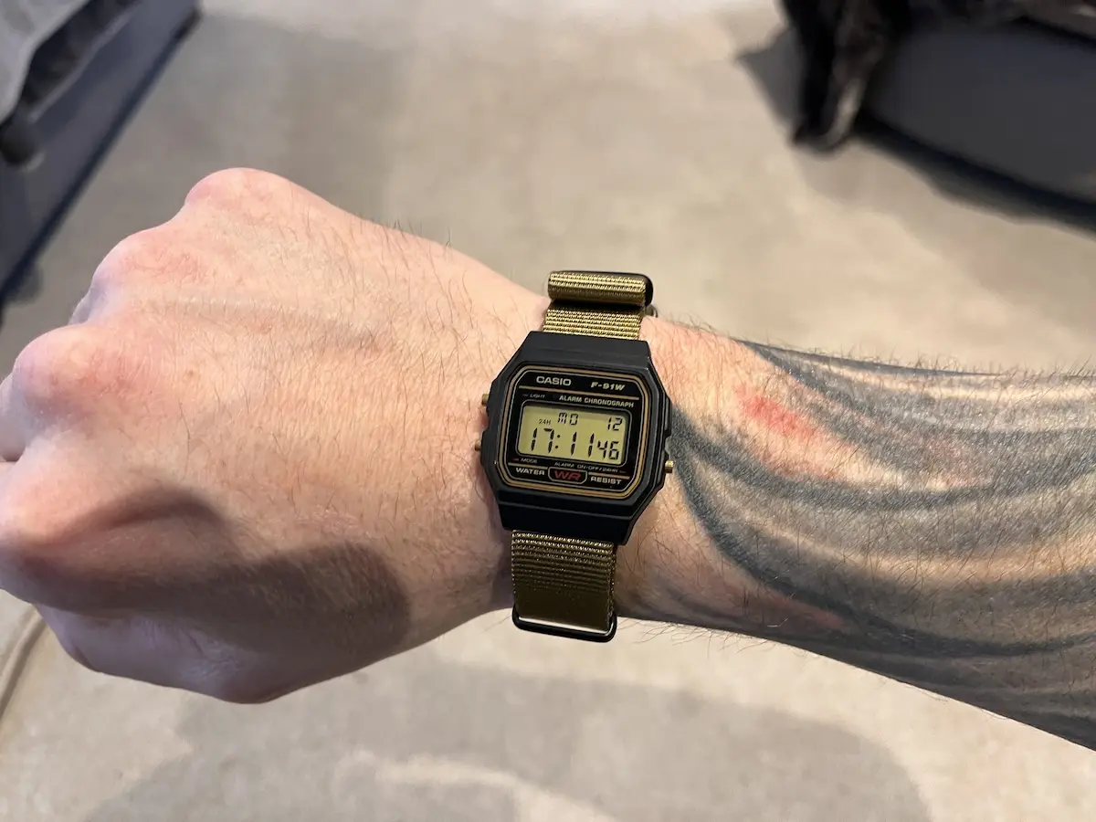 Black and gold F-91W on a khaki nato strap