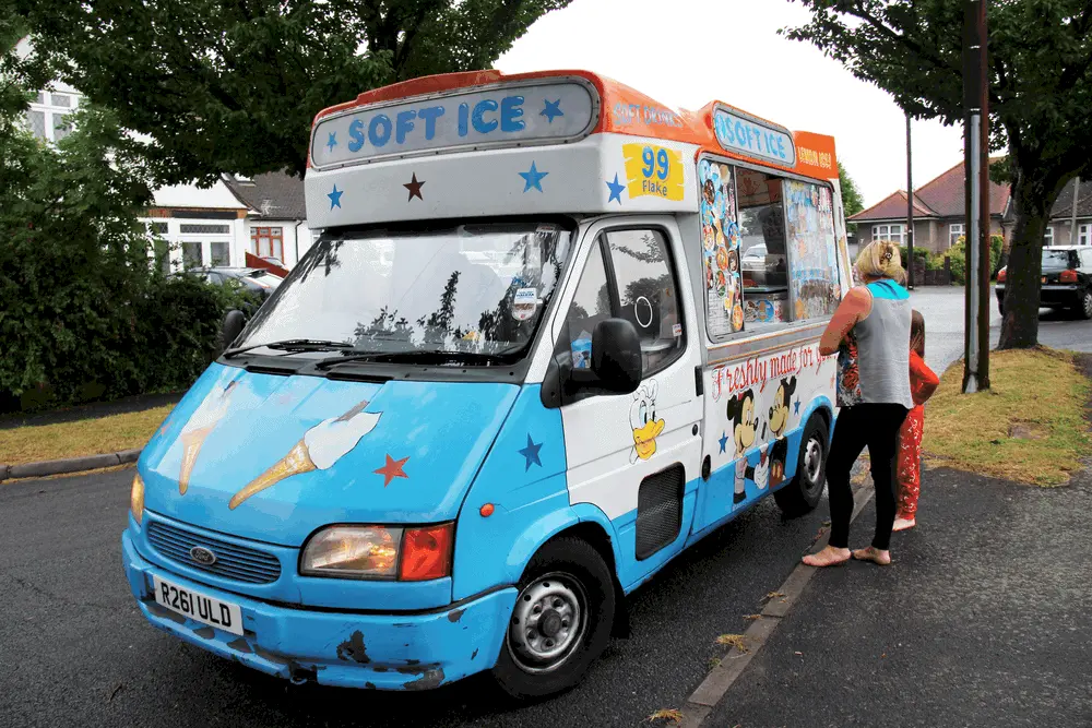 A typical ice cream van showcasing a very happy child and an undoubtedly distraught parent.