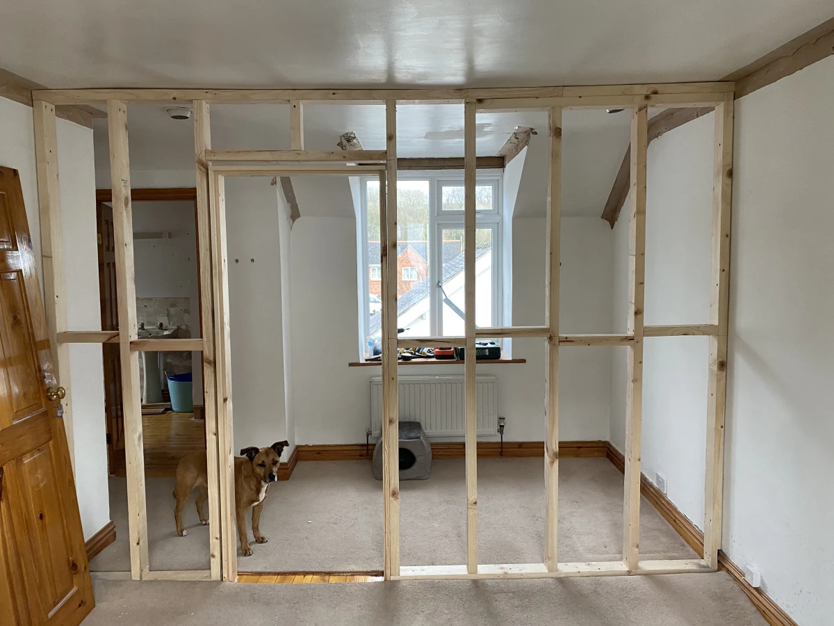 Putting the stud wall up to section off the master bedroom